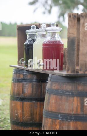 Brown barrels refreshment stand with lemon aid bottles Stock Photo