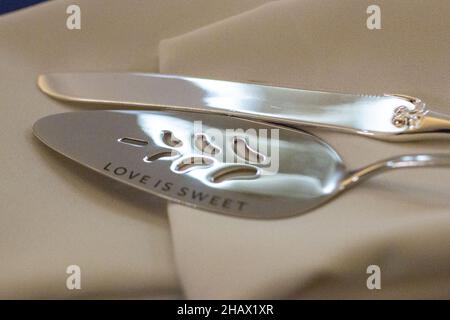 Cake serving silverwear with love ids sweet engraved Stock Photo