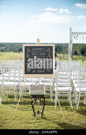 Wedding ceremony sign pick a seat not side Stock Photo