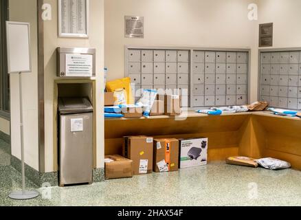The largesse of online shopping is strewn across the mailbox area in an apartment building in New York on Tuesday, December 8, 2021. (© Richard B. Levine)