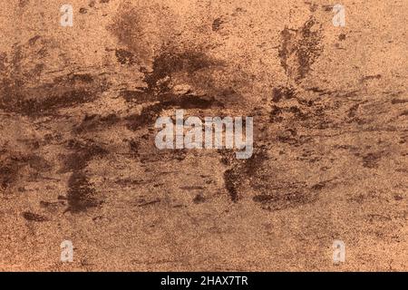 Scattered black spots on brown concrete wall with grunge texture for background Stock Photo