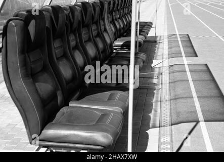 vip empty blue seats on outdoor sport stadium arena for football fans, luxury Stock Photo