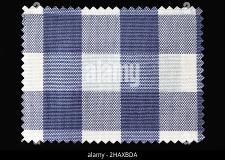 Blue and white checkered fabric sample isolated on black background Stock Photo