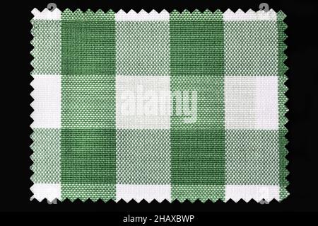 Green and white checkered fabric sample isolated on black background Stock Photo