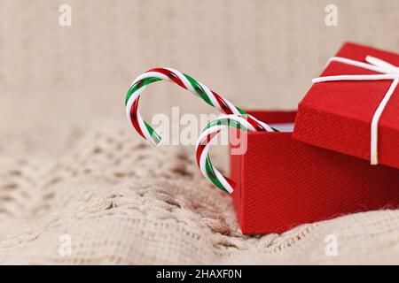 Two striped Christmas candy canes in red gift box Stock Photo