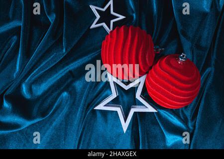 Christmas composition of stars, red balls on a velvet background Stock Photo
