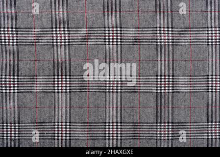 Factory made woolen check fabric as background. Abstract fabric background. Stock Photo