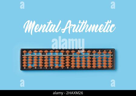Abacus for mental math. Abacus on colored background. Mental arithmetic and Mathematics concept Stock Photo