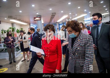 United States Senator Susan Collins (Republican of Maine), left, and United States Senator Jacky Rosen (Democrat of Nevada) make their way through the Senate subway during a vote at the US Capitol in Washington, DC, Wednesday, December 15, 2021. Credit: Rod Lamkey/CNP /MediaPunch Stock Photo