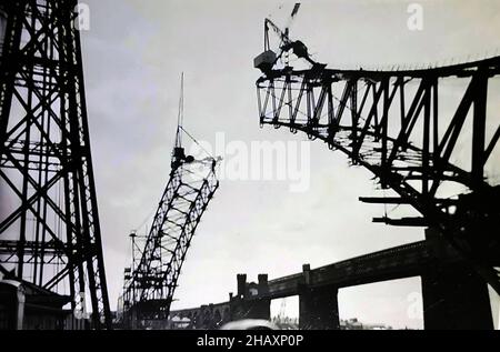 The Silver Jubilee Bridge under construction in the late 1950s in Runcorn, Cheshire, UK