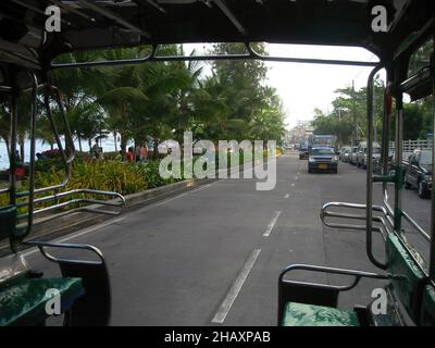 The view from the back of a Songthaew (taxi) in the resort of Pattaya, Thailand Stock Photo
