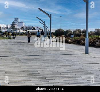 Part of the lengthy walkway that connects Vilamoura to Quarteira In Portugal. Stock Photo
