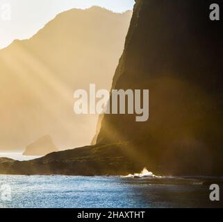 Golden sea waves in morning sunrise in Madeira island, Portugal Stock Photo