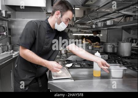 Chef cooking in modern industrial kitchen. High quality photo Stock Photo