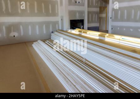 Wooden moldings in the house are ready to install with under construction home Stock Photo