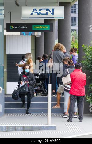 Sydney, Australia. 16 Dec 2021. Welfare recipients outside a Centrelink social security office in Bondi Junction. Credit: Robert Wallace / Wallace Media Network / Alamy Live News
