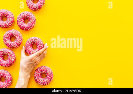 Set of pink glazed donutes with sprinkles, top view Stock Photo - Alamy