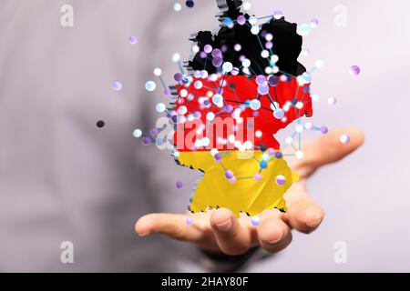 3D rendered German map hovering on a person's hand Stock Photo