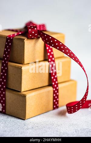Stack of three gift boxes tied with a red ribbon Stock Photo