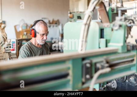 male employee working in an industrial factory Stock Photo