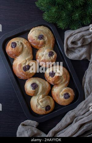 Swedish and scandinavian saffron buns Lussekatter on a table Stock Photo