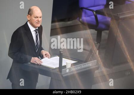 Berlin, Germany. 15th Dec, 2021. German Chancellor Olaf Scholz delivers his first government statement at the Reichstag building in Berlin Dec. 15, 2021, after he was elected as the new federal chancellor Dec. 8. Credit: Shan Yuqi/Xinhua/Alamy Live News Stock Photo