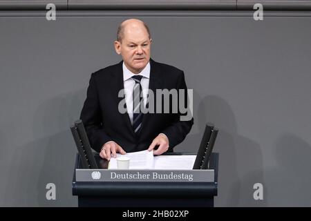 Berlin, Germany. 15th Dec, 2021. German Chancellor Olaf Scholz delivers his first government statement at the Reichstag building in Berlin Dec. 15, 2021, after he was elected as the new federal chancellor Dec. 8. Credit: Shan Yuqi/Xinhua/Alamy Live News Stock Photo