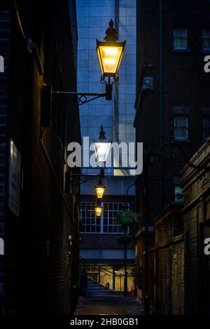 Street lamps in narrow street, London, England, UK Stock Photo