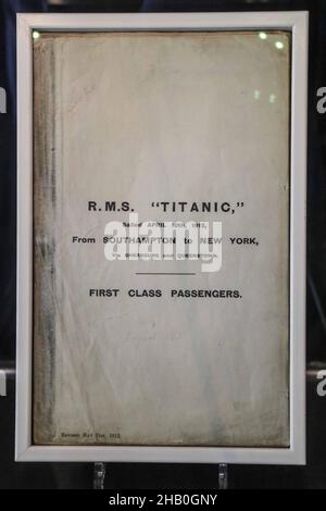 London UK 16 December 2021 Original passenger list of the Titanic, revised and approved by the White Star Line on 6th June 1912 . Billed as an emotional experience, Titanic: The Exhibition is far more than a display of historic items: it is a unique narrative experience, a tale of the people aboard history’s most legendary ship on its maiden and final journey. Travel back to 1912 through photographs, handwritten letters, wayward keepsakes, and other personal belongings telling countless stories about the fates and heroic deeds on board. from 17th December 2021 Dock X London - Retail Park, Unit Stock Photo