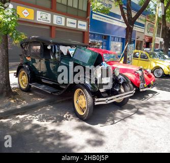 BUENOS AIRES, ARGENTINA - Nov 08, 2021: Old green Ford Model A Phaeton 1929 parked on the sidewalk. Open hood. Expo Warnes 2021 classic car show Stock Photo