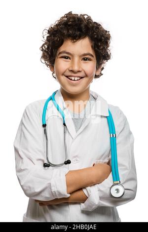 Middle eastern boy playing in doctor profession using a stethoscope. Child's hobby and future medical occupation. White background Stock Photo