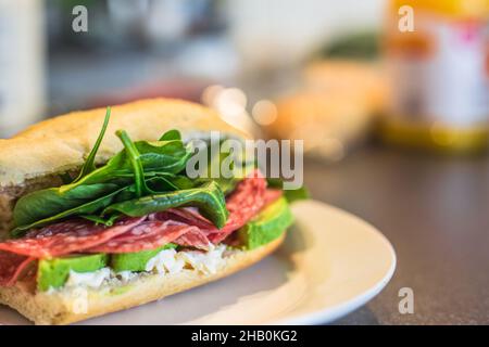 Tasty grilled burger with beef, tomato, cheese, cucumber and onion rings Stock Photo