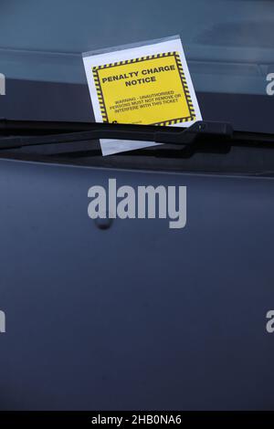 A parking ticket / penalty charge notice pictured on a car in Portsmouth, Hampshire, UK. Stock Photo