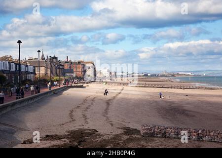 Edinburgh, Scotland-September 22, 2013: On sunny days, the people of Edinburgh take the opportunity to stroll along Portobello Beach Stock Photo