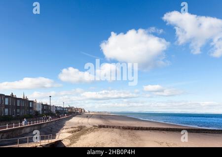 Edinburgh, Scotland-September 22, 2013: On sunny days, the people of Edinburgh take the opportunity to stroll along Portobello Beach Stock Photo