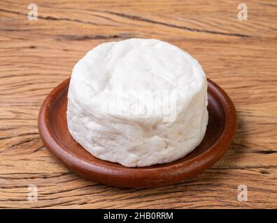 Frescal cheese, typical brazilian fresh white cheese over wooden table. Stock Photo