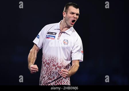 Madars Razma celebrates after winning his first round match against ...