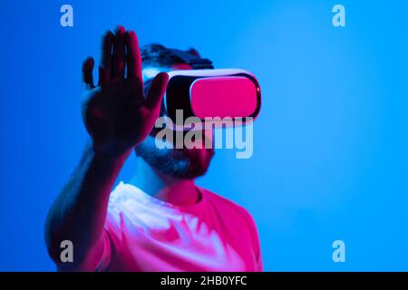 Businessman in 3d goggles interacts with cyberspace. Stock Photo