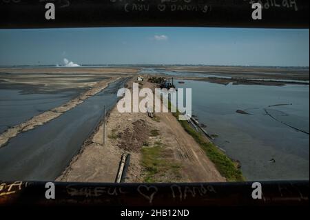 Photo dated October 19, 2016 - The Lapindo volcanic mudflow area seen in Sidoarjo, East Java province, Indonesia. Since May 29, 2006 until now, as 1,143.3 hectares area land has changes be the natural territory of the world's largest mud volcano were belches water, oil, methane gas and mud everytime. The geological activity is a contributor to methane gas emissions amount as the largest natural gas manifestation on earth, based on the study report published in the journal Scientific Reports on February 18, 2021. Photo by Sutanta Aditya/ABACAPRESS.COM Stock Photo