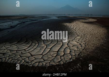 Photo dated October 19, 2016 - Arjuno volcano seen from the Lapindo volcanic mudflow area in Sidoarjo, East Java province, Indonesia. Since May 29, 2006 until now, as 1,143.3 hectares area land has changes be the natural territory of the world's largest mud volcano were belches water, oil, methane gas and mud everytime. The geological activity is a contributor to methane gas emissions amount as the largest natural gas manifestation on earth, based on the study report published in the journal Scientific Reports on February 18, 2021. Photo by Sutanta Aditya/ABACAPRESS.COM Stock Photo