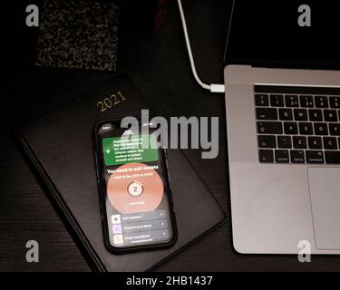 Covid-10 app on smarter phone counting down the remaining days of isolation -2 days remaining Stock Photo