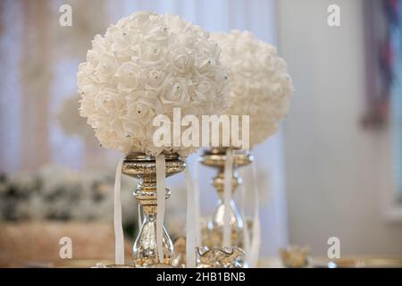 Gold table centerpieces with white ball flowers with diamonds Stock Photo