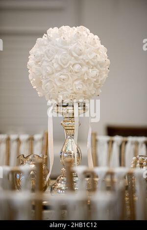 Gold table centerpieces with white ball flowers with diamonds Stock Photo