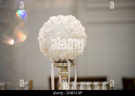 Gold table centerpieces with white ball flowers with diamonds Stock Photo