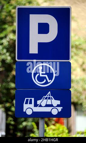 vehicle removal service in case of taking the disabled parking space sign close up photo Stock Photo