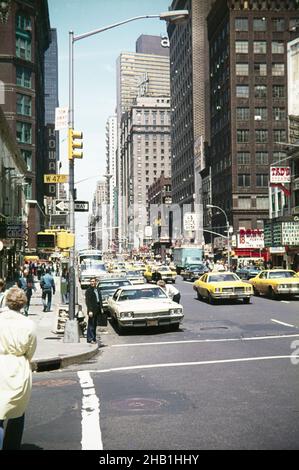 Yellow taxi cabs West 51st Street, New York, USA 1976, corner of West 47th Street - Hotel Taft in middle distance Stock Photo