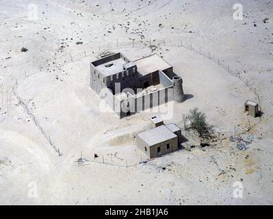 Traditional adobe mud house and compound in desert, Saudi Arabia 1979 Stock Photo