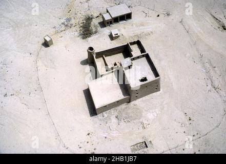 Traditional adobe mud house and compound in desert, Saudi Arabia 1979 Stock Photo