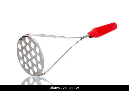 One metal potato masher, macro, isolated on white. Stock Photo