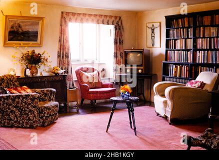 Holiday home cottage interior of living room with television and furniture, 1962 Stock Photo